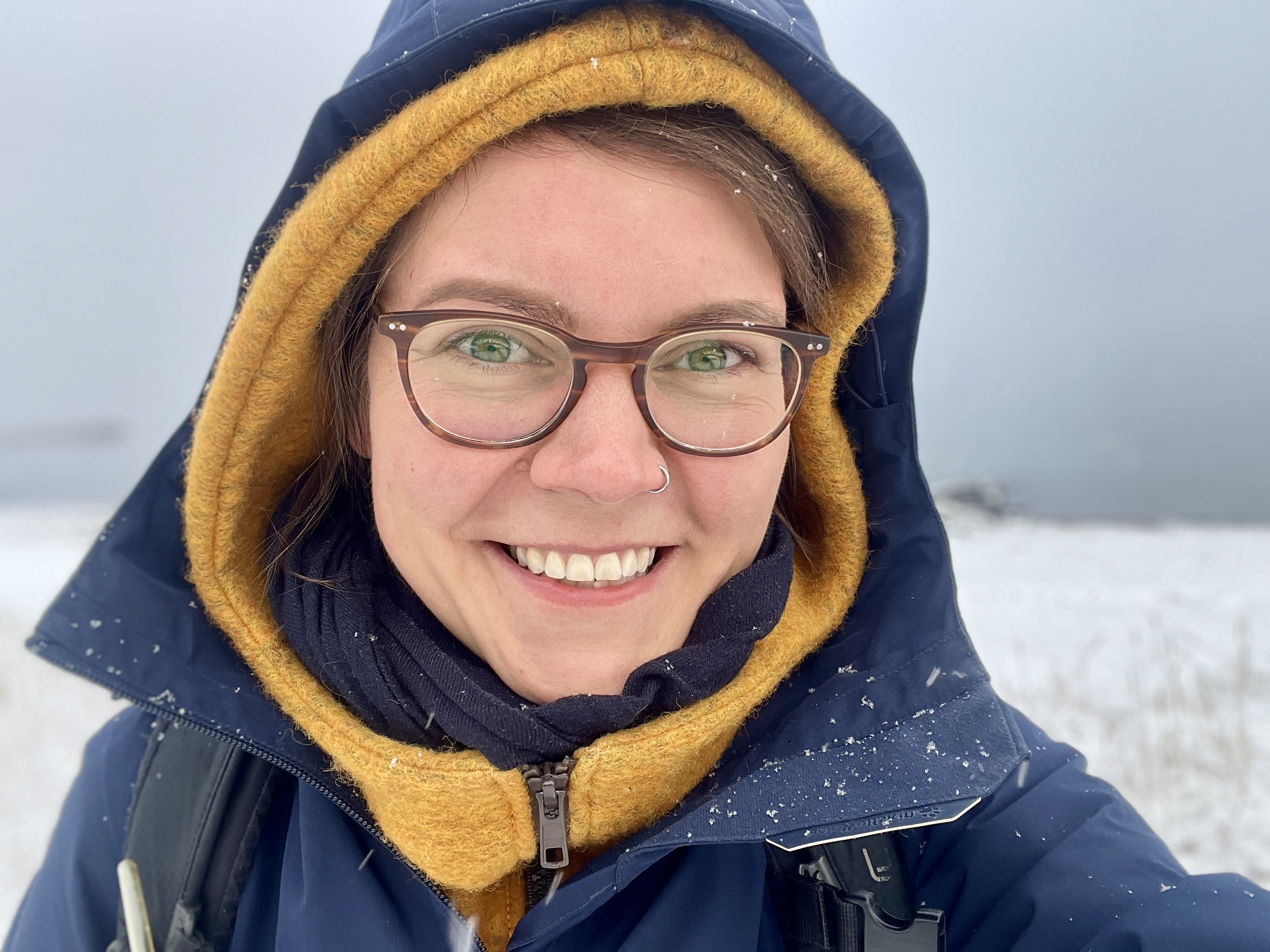 selfie while it's snowing lightly, taken during social anthropology fieldwork in Kangiqsujuaq, Canada. Nov 2023